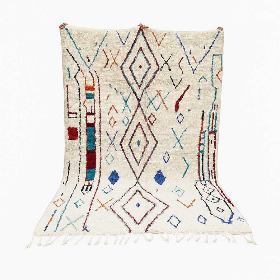 Handmade white Moroccan wool rug with blue, red, and orange geometric motifs – Berber design