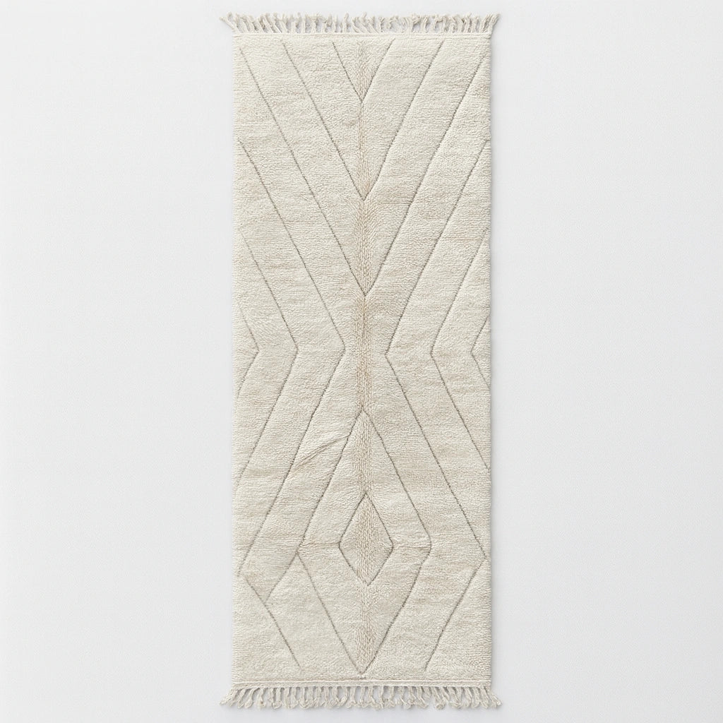 Handmade white Moroccan wool runner rug with minimalist geometric carved pattern