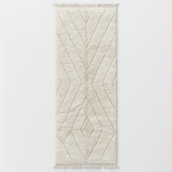 Handmade white Moroccan wool runner rug with minimalist geometric carved pattern