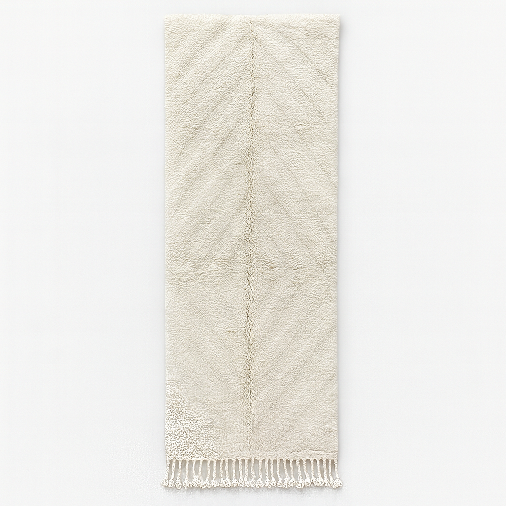 Handmade white Moroccan runner rug with subtle carved chevron texture in natural wool.