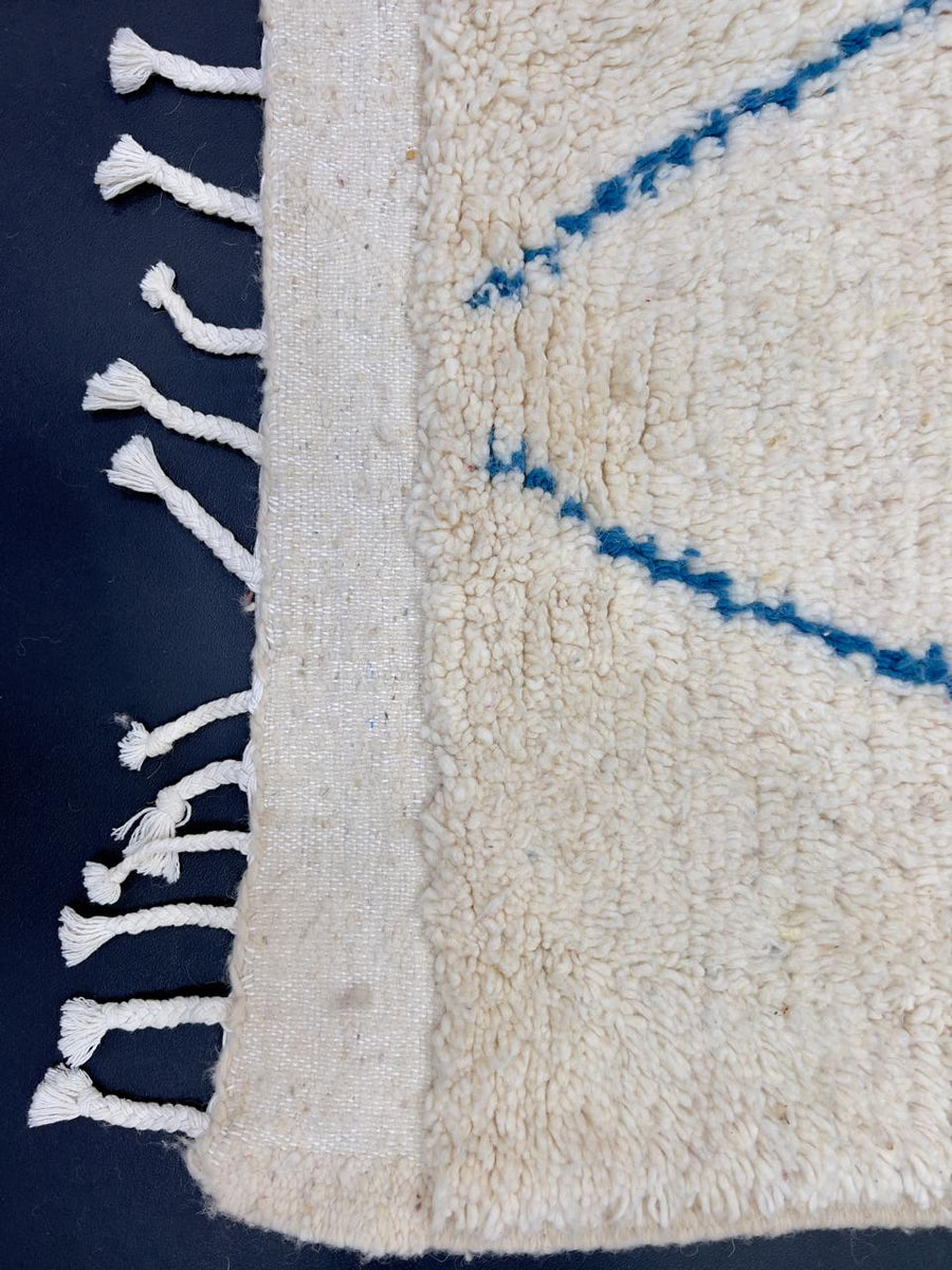 Handmade white Moroccan wool runner rug with multicolor diamond and line motifs