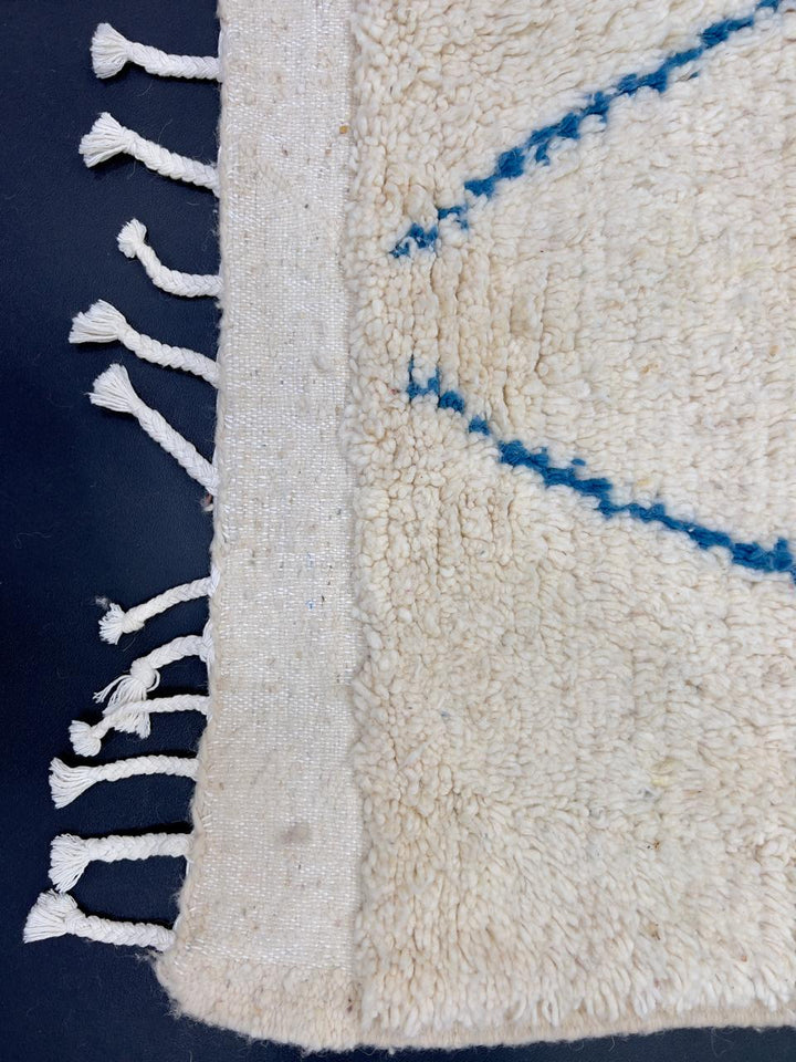 Handmade white Moroccan wool runner rug with multicolor diamond and line motifs