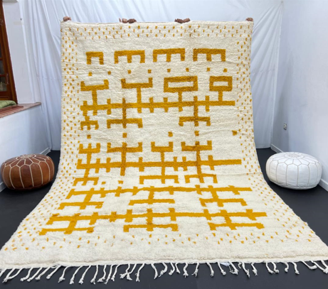 white moroccan wool rug with yellow berber geometric symbols handmade