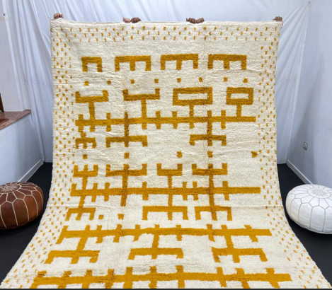 white moroccan wool rug with yellow berber geometric symbols handmade