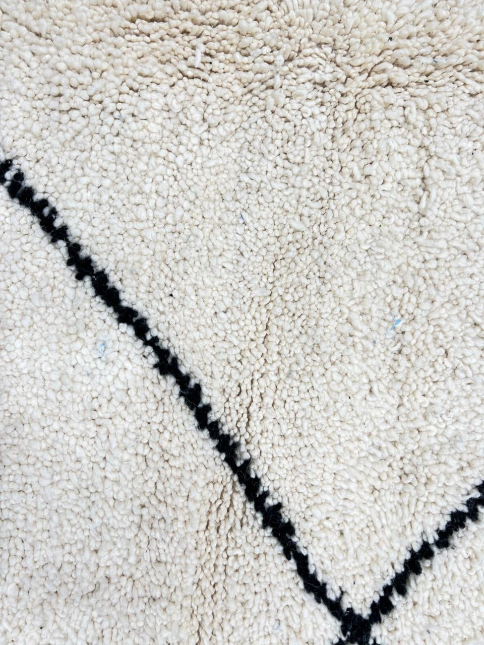 Handmade Moroccan wool runner rug in white with black diamond-line design, Beni Ourain style