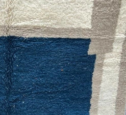 Handmade white and navy blue Moroccan wool runner rug with geometric border design