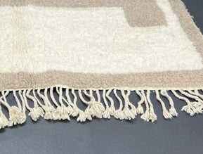 Handmade white and navy blue Moroccan wool runner rug with geometric border design