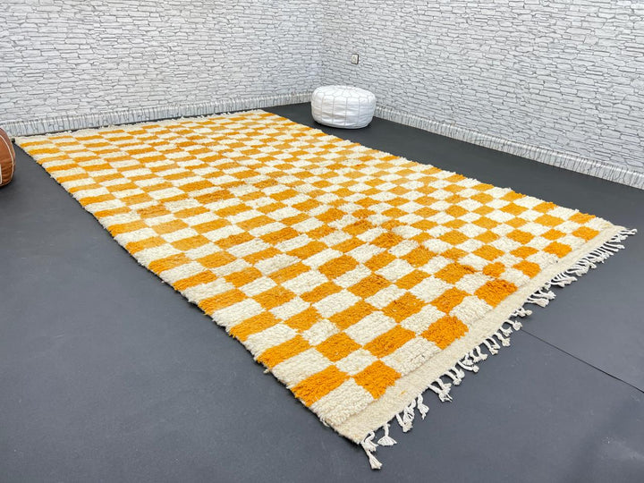 Handwoven Moroccan wool rug with yellow and cream checkered pattern
