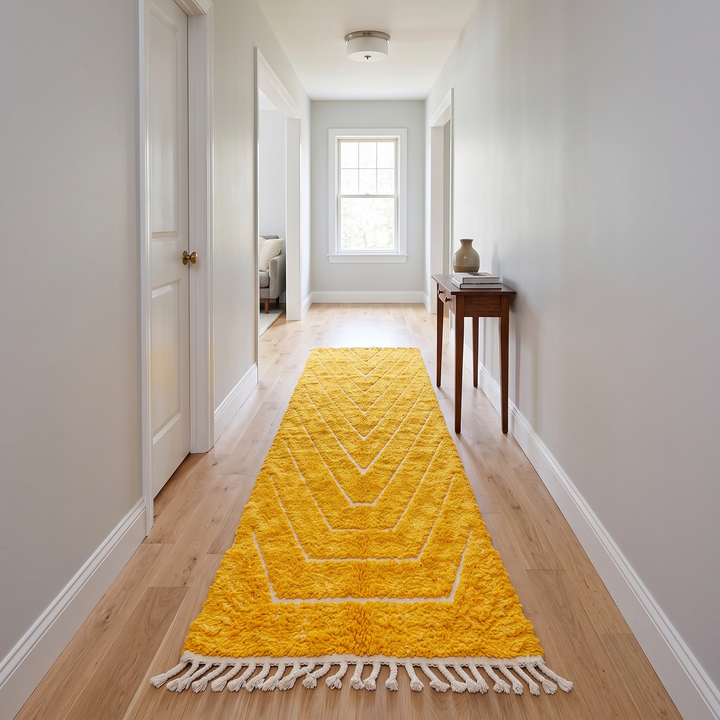Abstract Moroccan runner rug handwoven in saffron gold wool with carved white chevron lines