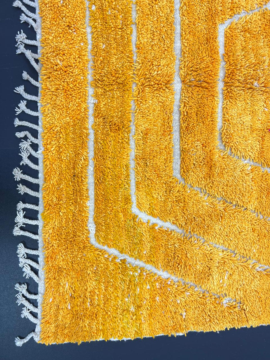 Abstract Moroccan runner rug handwoven in saffron gold wool with carved white chevron lines