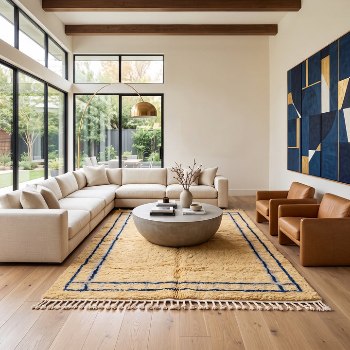 Handmade yellow Moroccan wool rug with blue border, soft plush Beni Mrirt design
