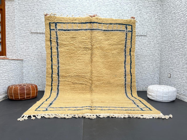 Handmade yellow Moroccan wool rug with blue border, soft plush Beni Mrirt design
