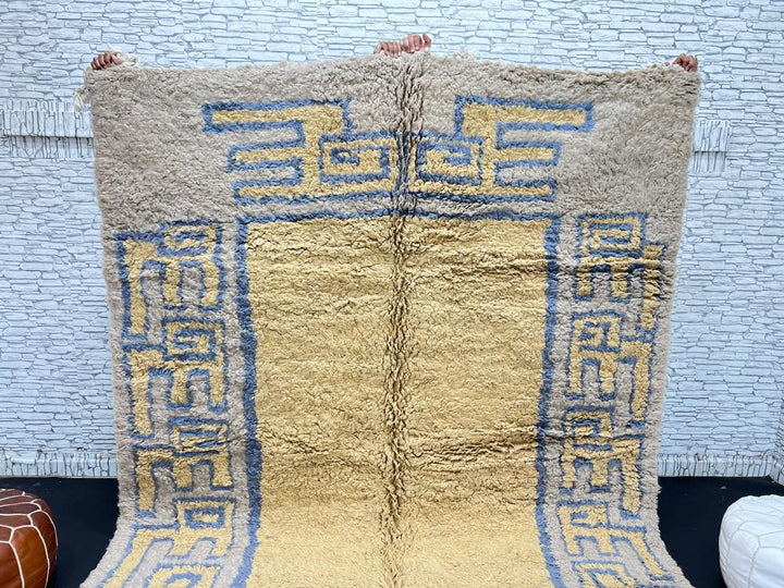 Yellow and blue Moroccan wool rug with geometric Berber border pattern