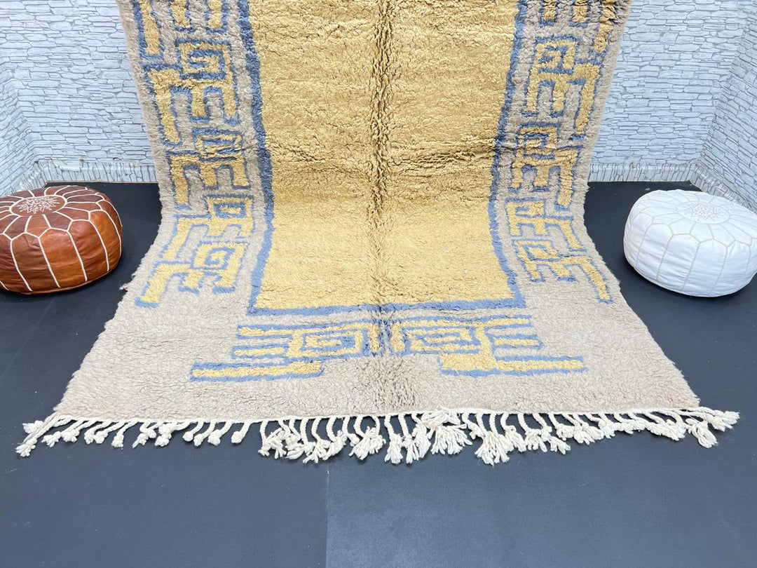 Yellow and blue Moroccan wool rug with geometric Berber border pattern