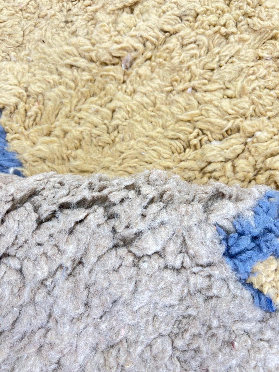 Yellow and blue Moroccan wool rug with geometric Berber border pattern