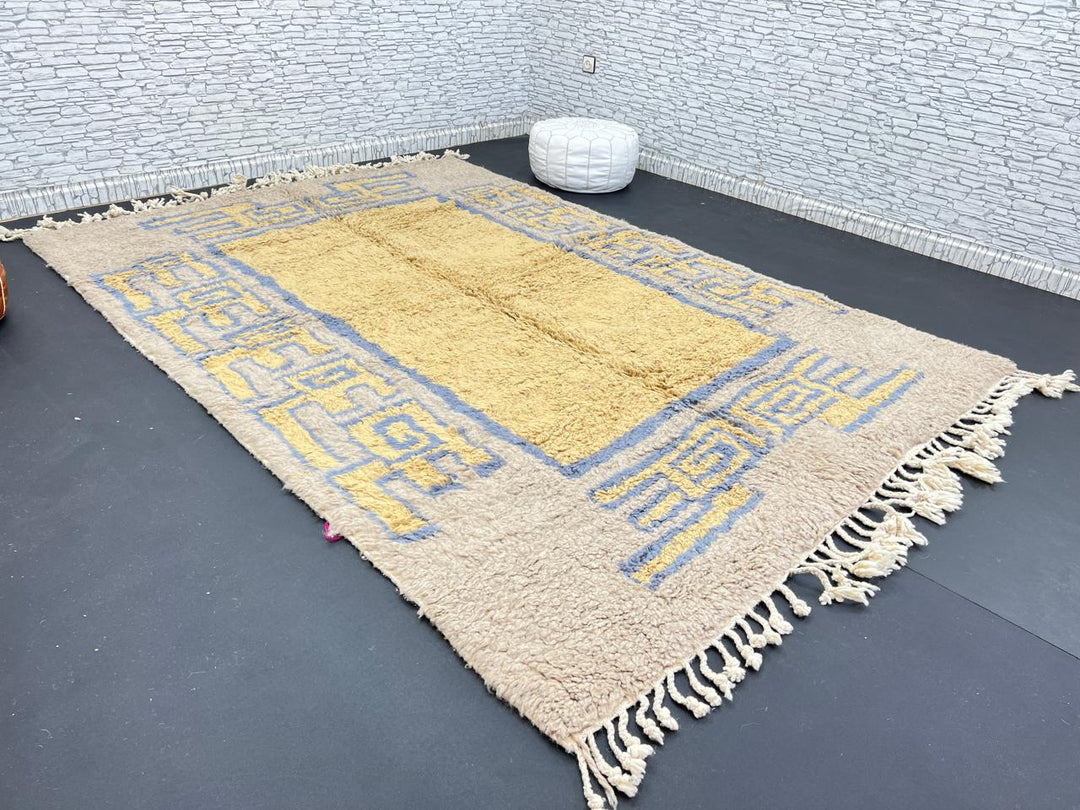Yellow and blue Moroccan wool rug with geometric Berber border pattern