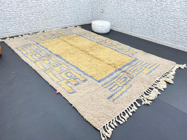 Yellow and blue Moroccan wool rug with geometric Berber border pattern