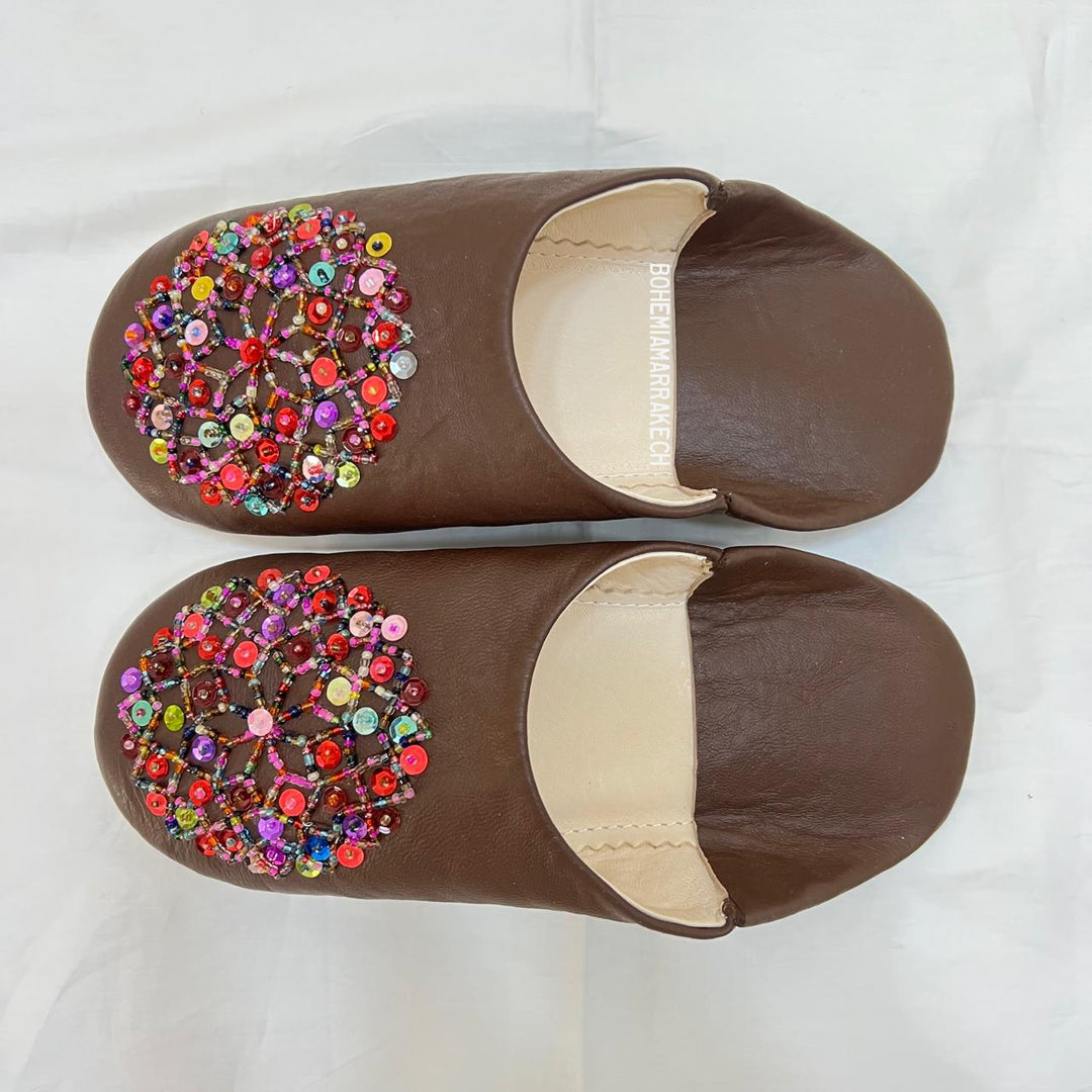 Handmade Moroccan leather babouche slippers with traditional pointed shape and simple hand stitching