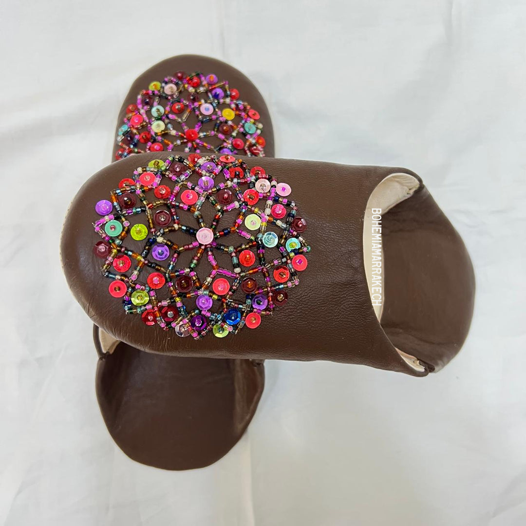 Handmade Moroccan leather babouche slippers with traditional pointed shape and simple hand stitching