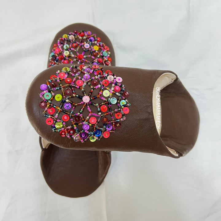 Handmade Moroccan leather babouche slippers with traditional pointed shape and simple hand stitching