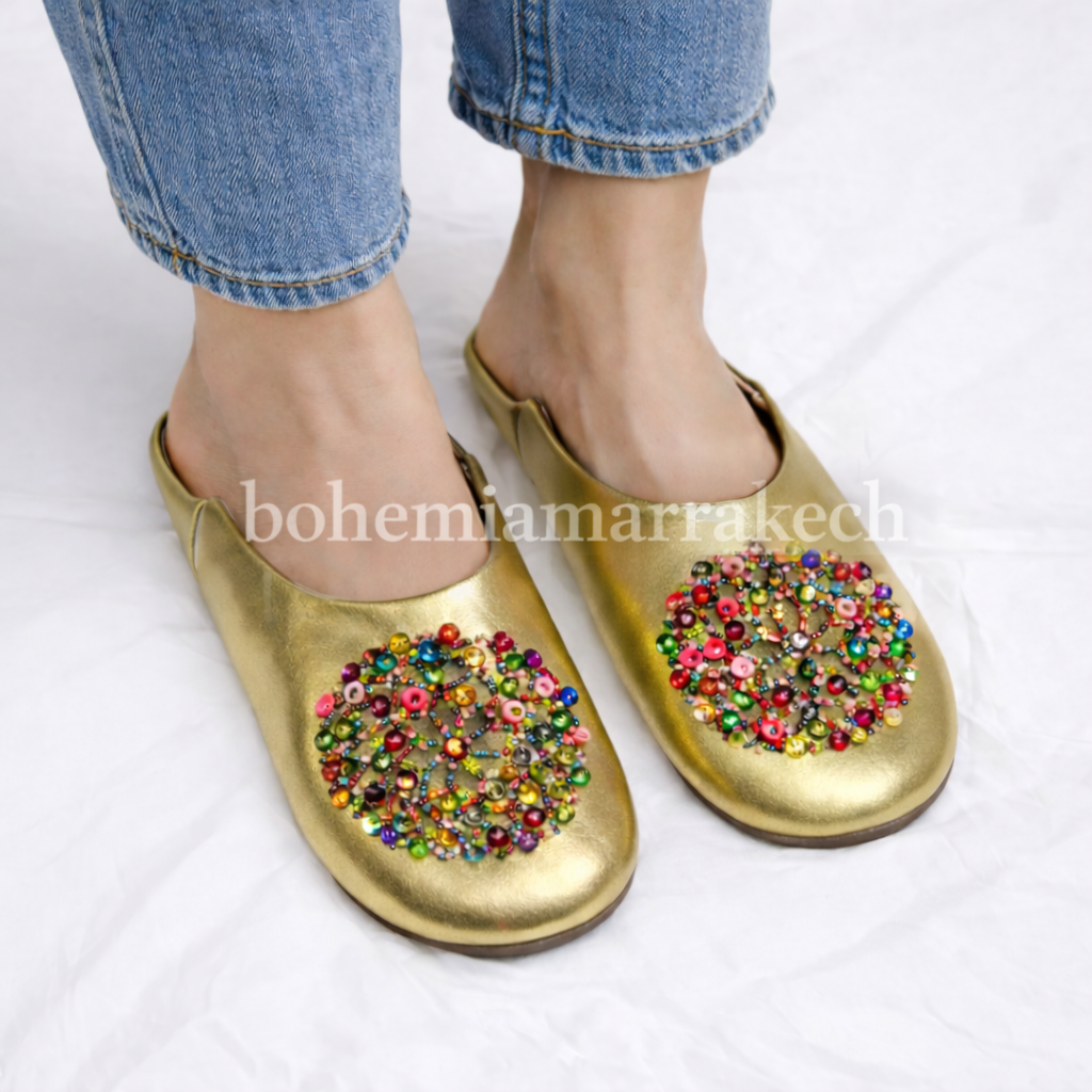 Handmade Moroccan leather babouche slippers with traditional pointed shape and simple hand stitching.