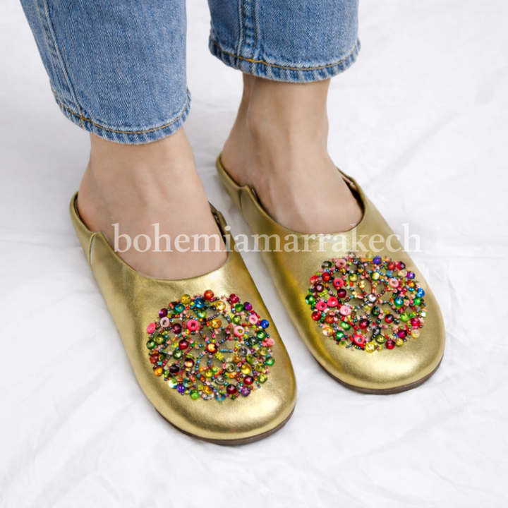 Handmade Moroccan leather babouche slippers with traditional pointed shape and simple hand stitching.