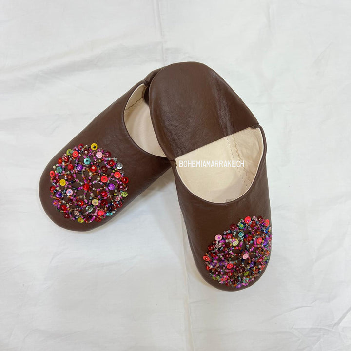 Handmade Moroccan leather babouche slippers with traditional pointed shape and simple hand stitching