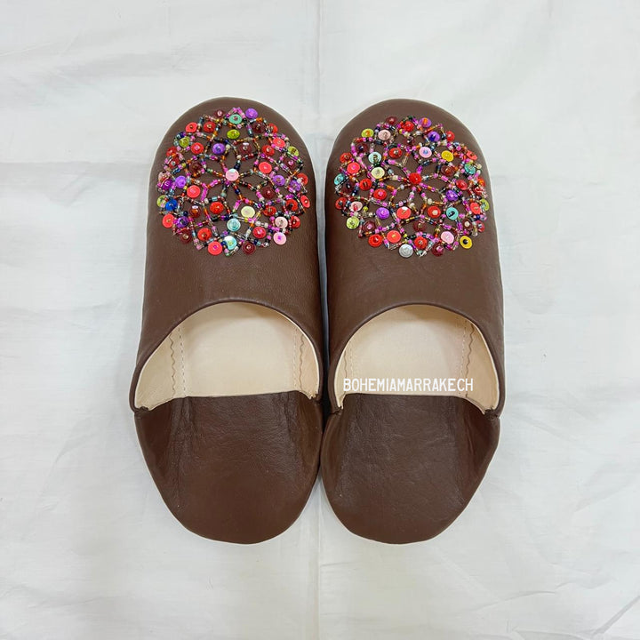 Handmade Moroccan leather babouche slippers with traditional pointed shape and simple hand stitching