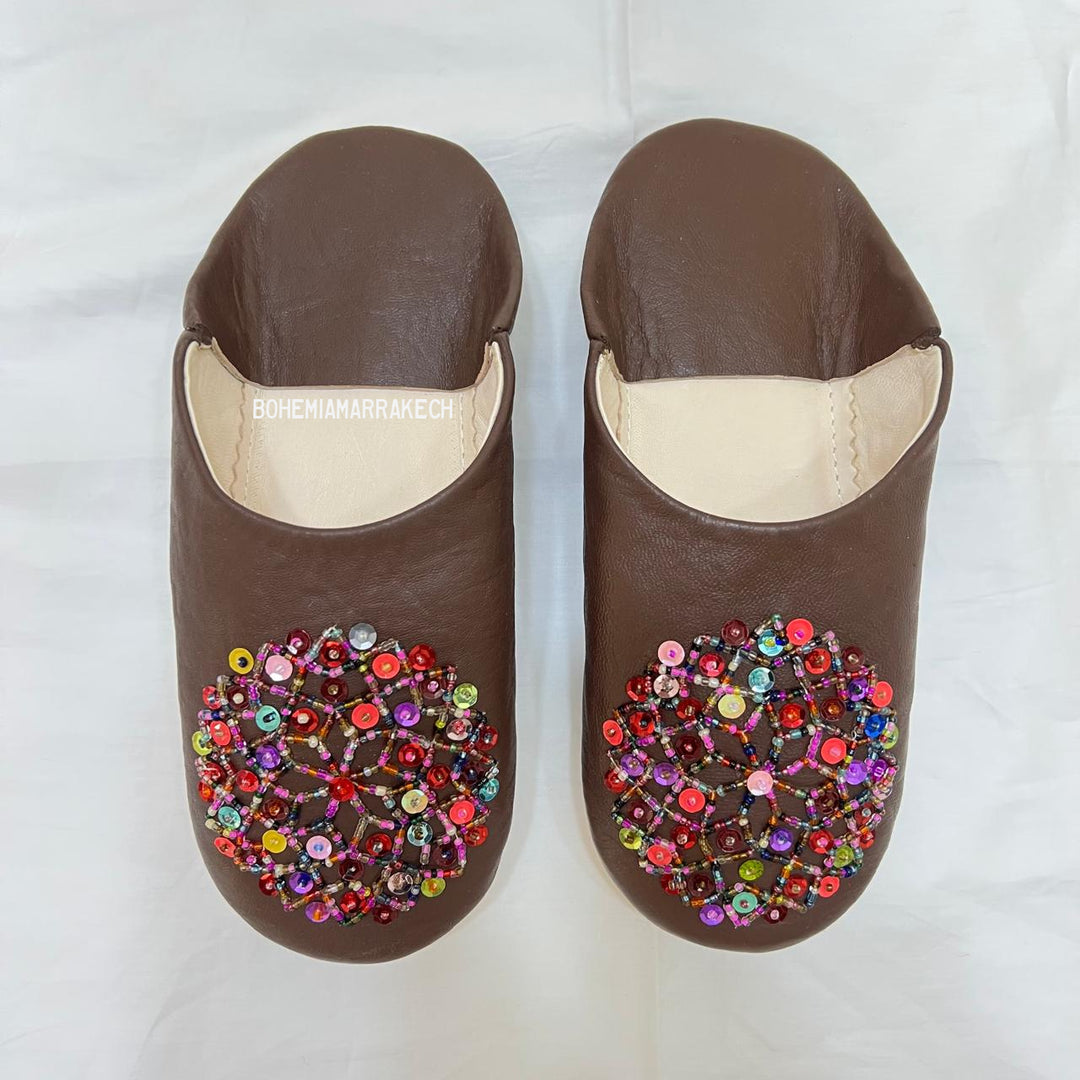 Handmade Moroccan leather babouche slippers with traditional pointed shape and simple hand stitching