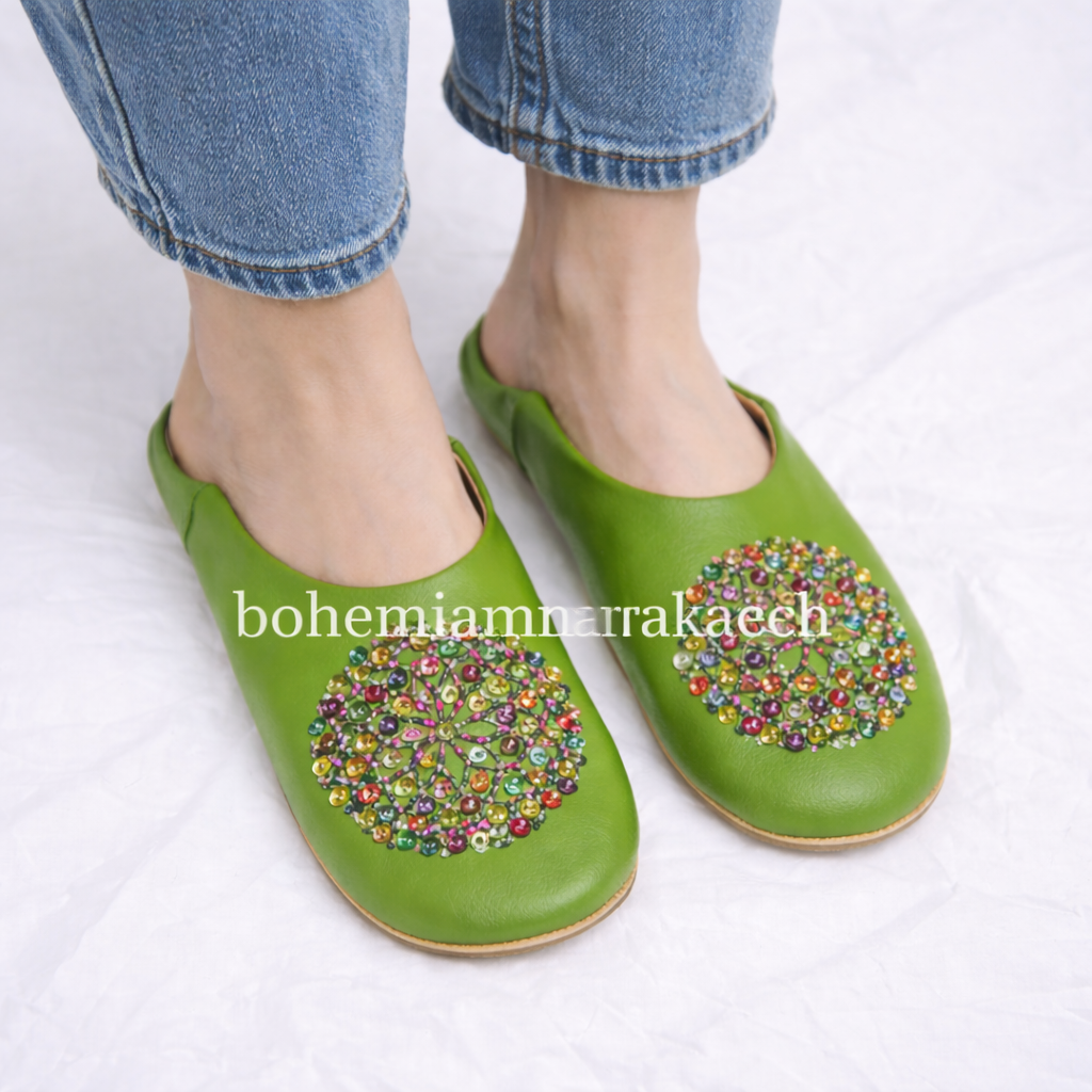 Handmade Moroccan leather babouche slippers with traditional pointed shape and simple hand stitching.