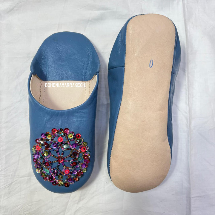 Traditional pointed Moroccan babouche slippers crafted from natural leather.