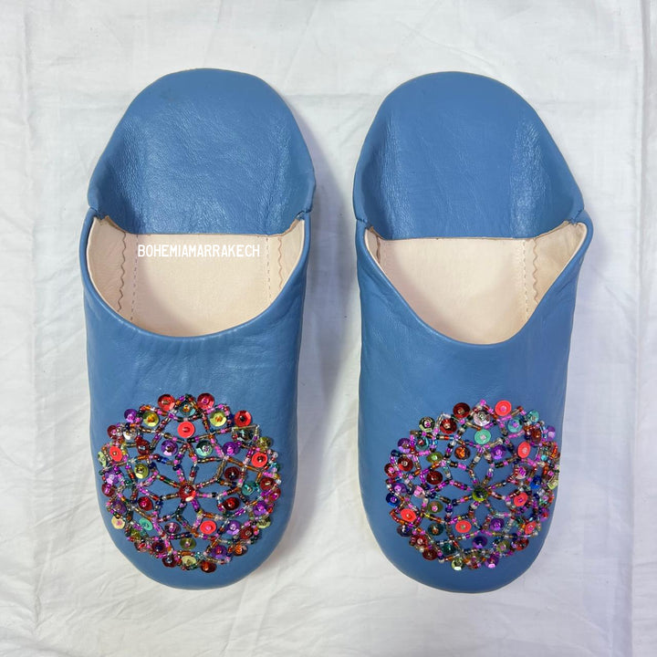 Traditional pointed Moroccan babouche slippers crafted from natural leather.