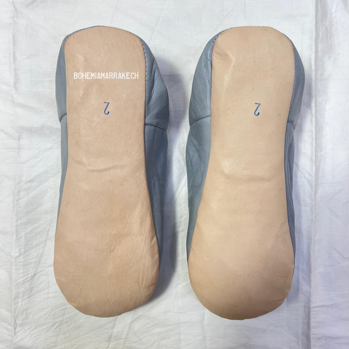 Traditional pointed Moroccan babouche slippers made from natural leather.