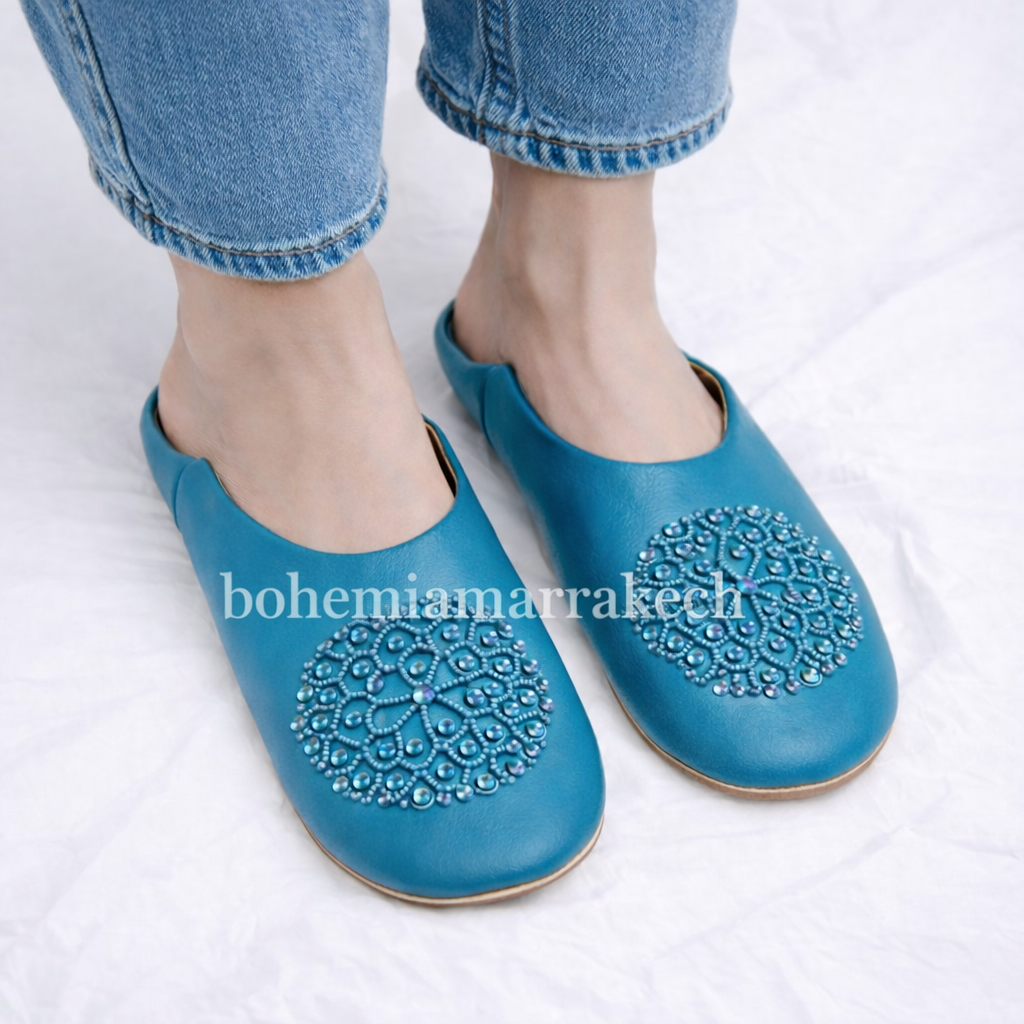 Handmade Moroccan leather babouche slippers with traditional pointed toe and hand stitching.