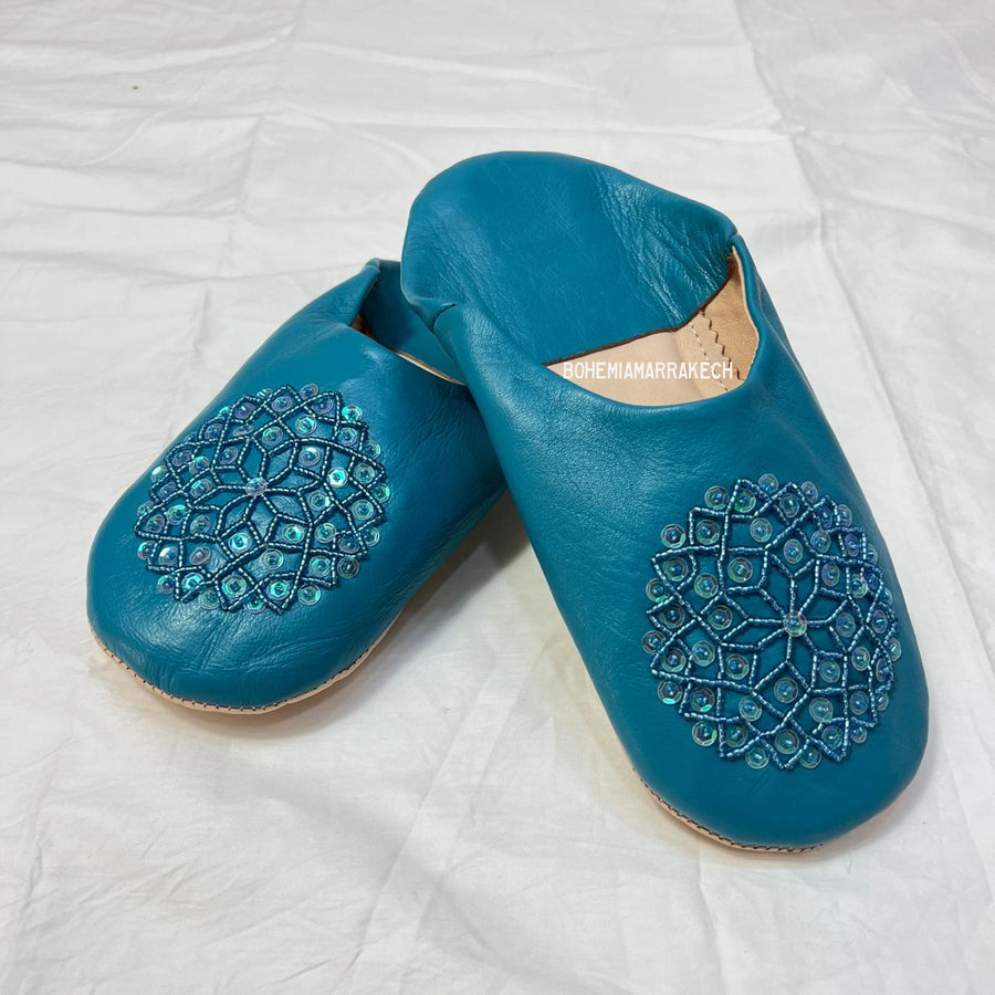 Handmade Moroccan leather babouche slippers with traditional pointed toe and hand stitching.