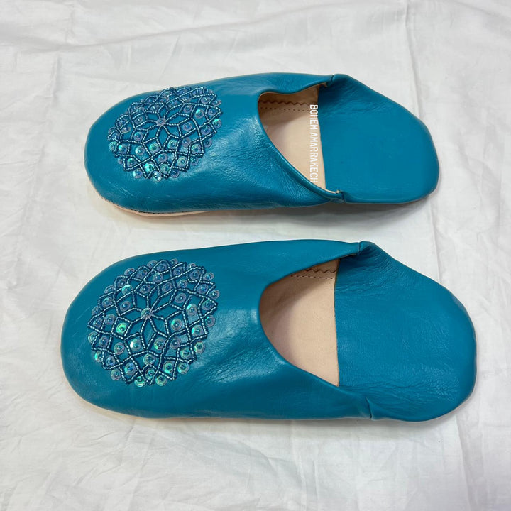 Handmade Moroccan leather babouche slippers with traditional pointed toe and hand stitching.