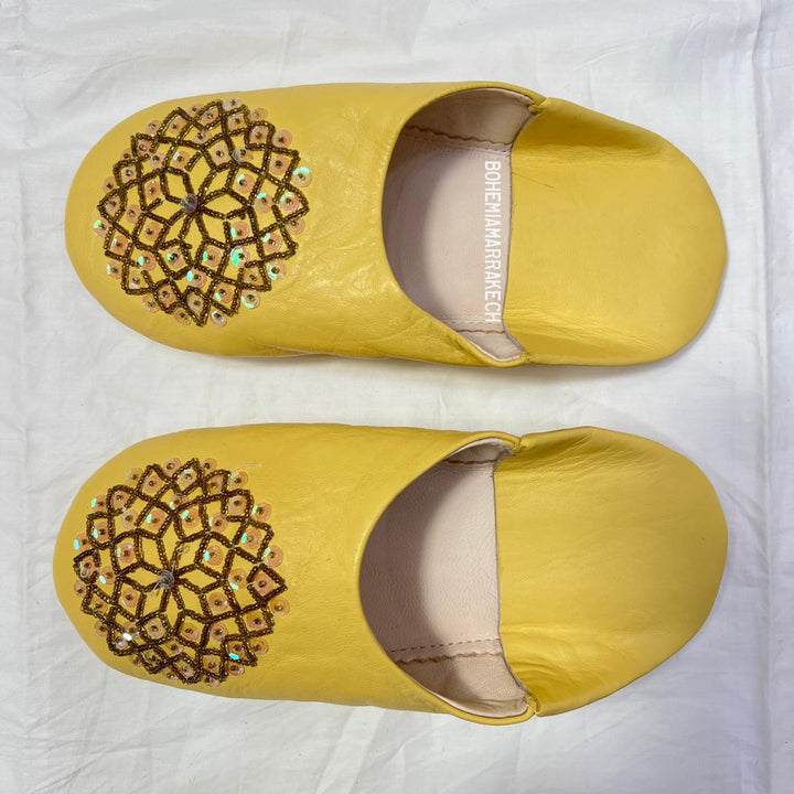 Artisan-made Moroccan babouche slippers for indoor wear.