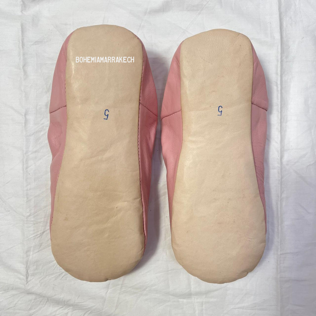 Traditional pointed Moroccan babouche slippers made from natural leather.