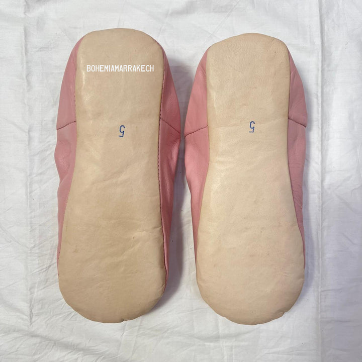 Traditional pointed Moroccan babouche slippers made from natural leather.
