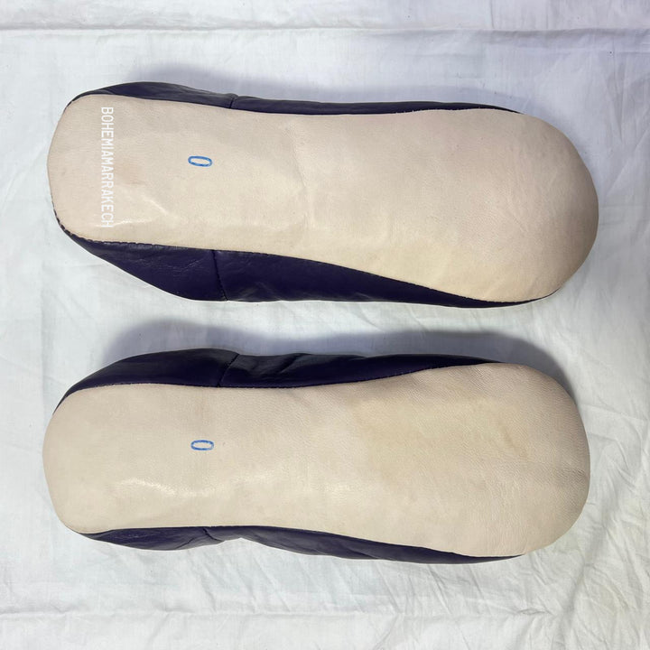 “Minimalist handmade Moroccan leather babouche slippers for indoor wear.”