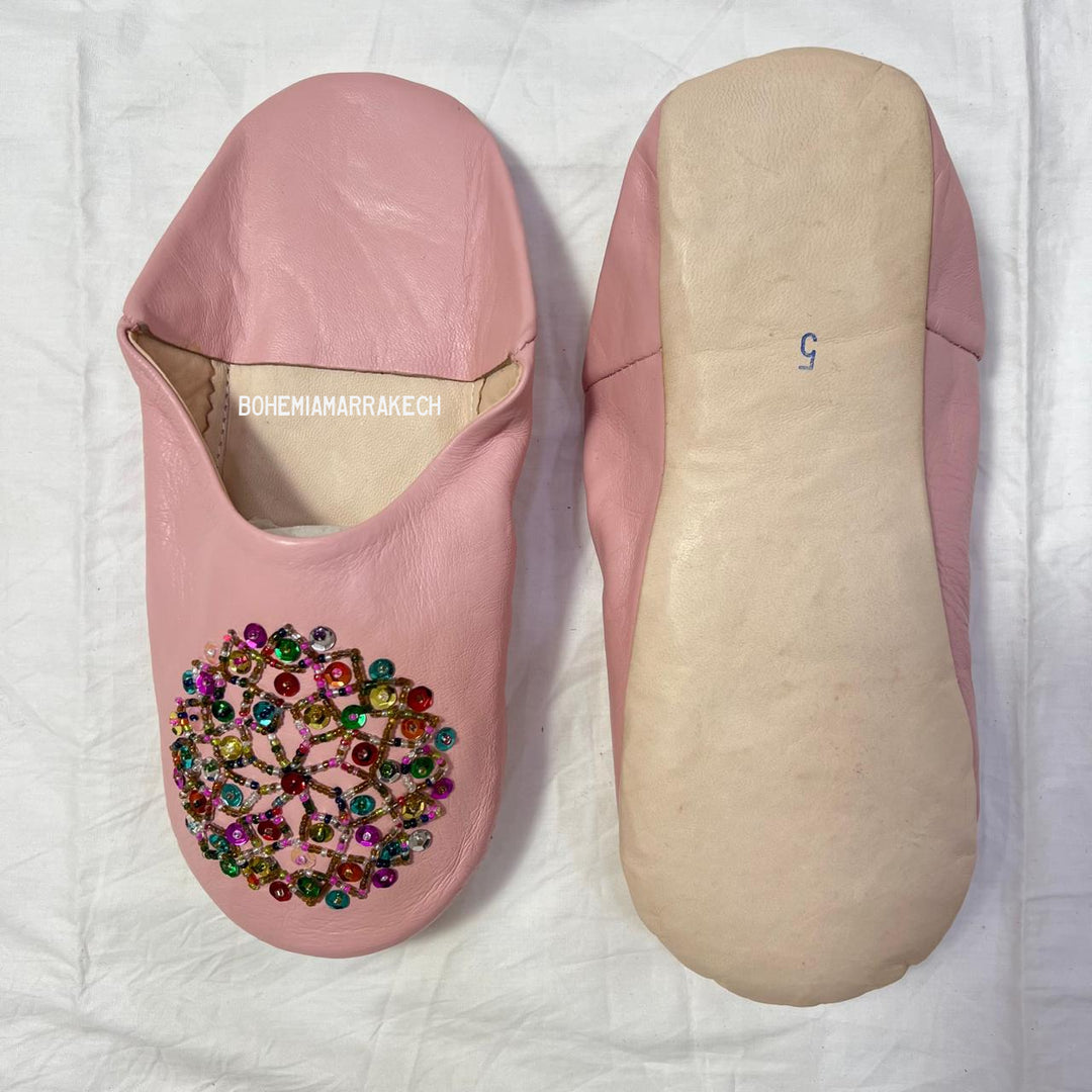 Traditional pointed Moroccan babouche slippers made from natural leather.