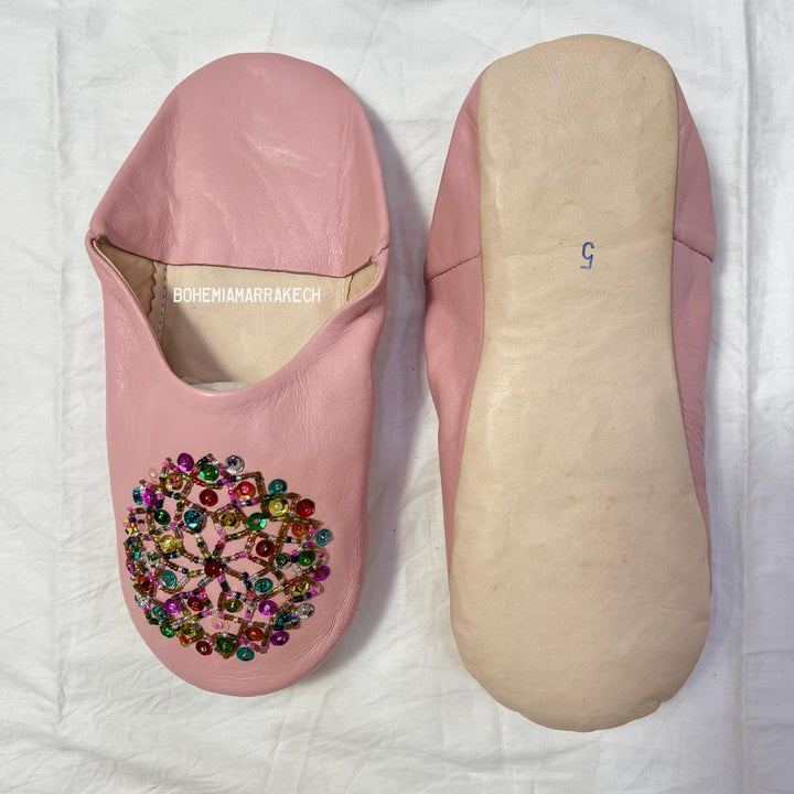 Traditional pointed Moroccan babouche slippers made from natural leather.