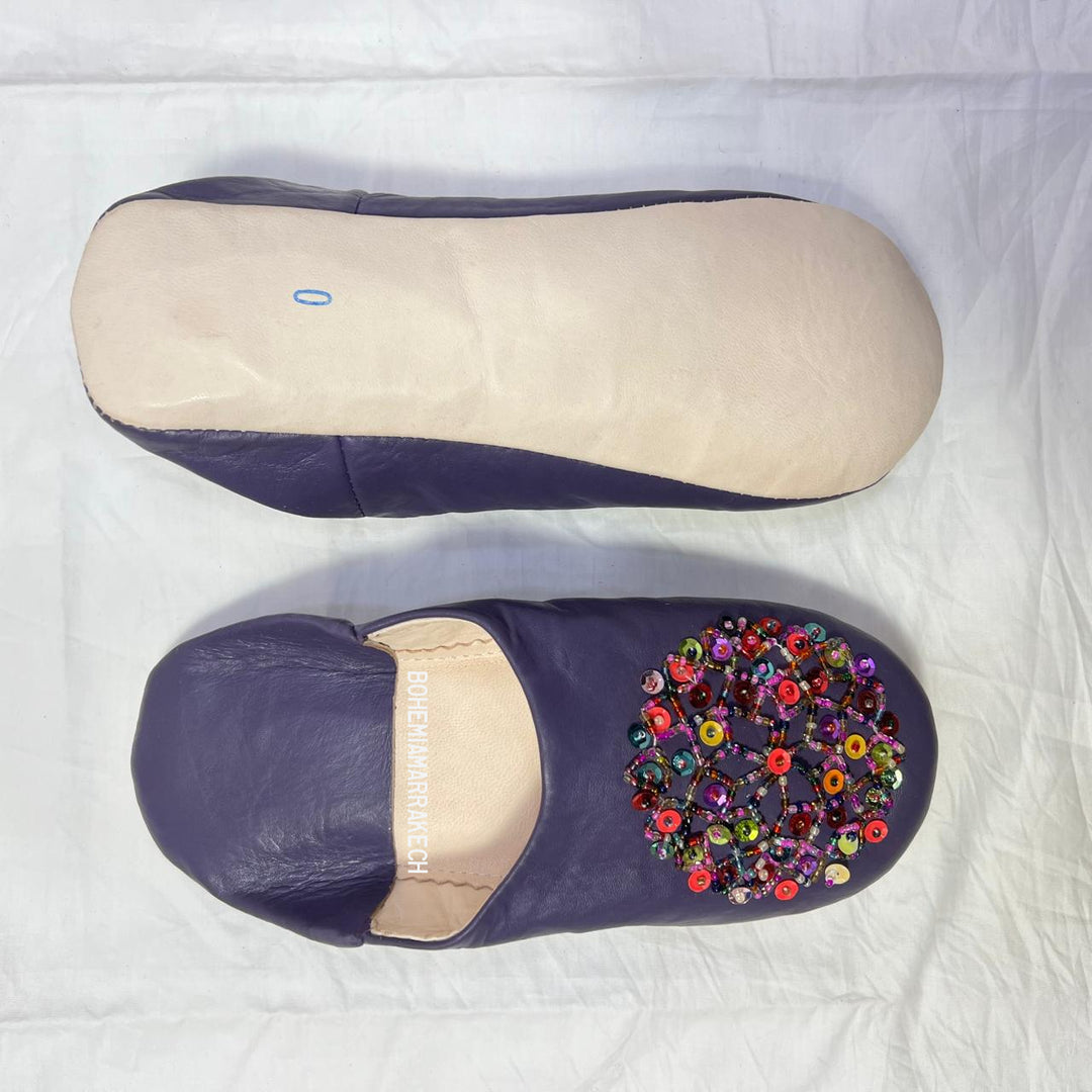 “Minimalist handmade Moroccan leather babouche slippers for indoor wear.”