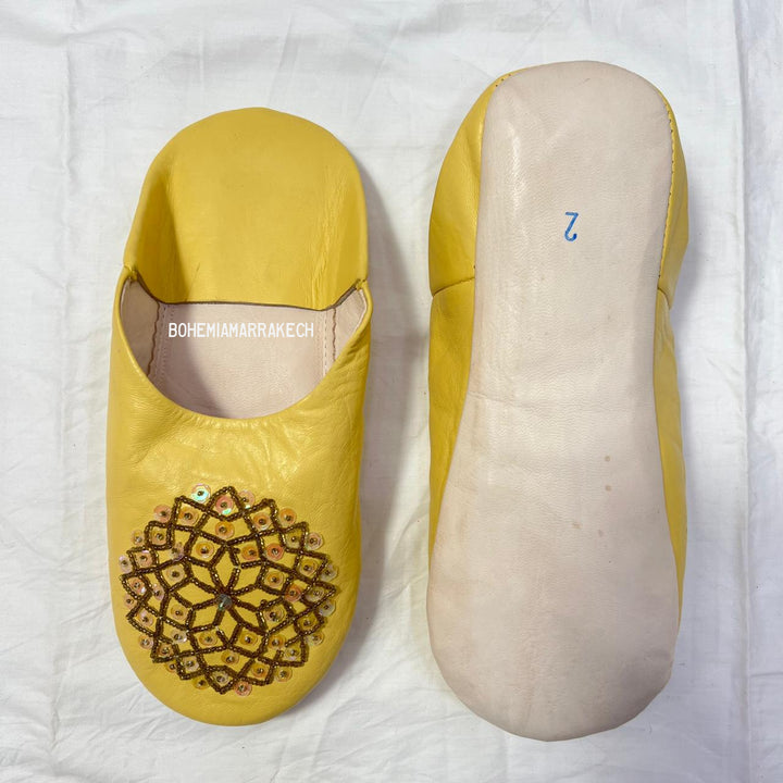 Artisan-made Moroccan babouche slippers for indoor wear.