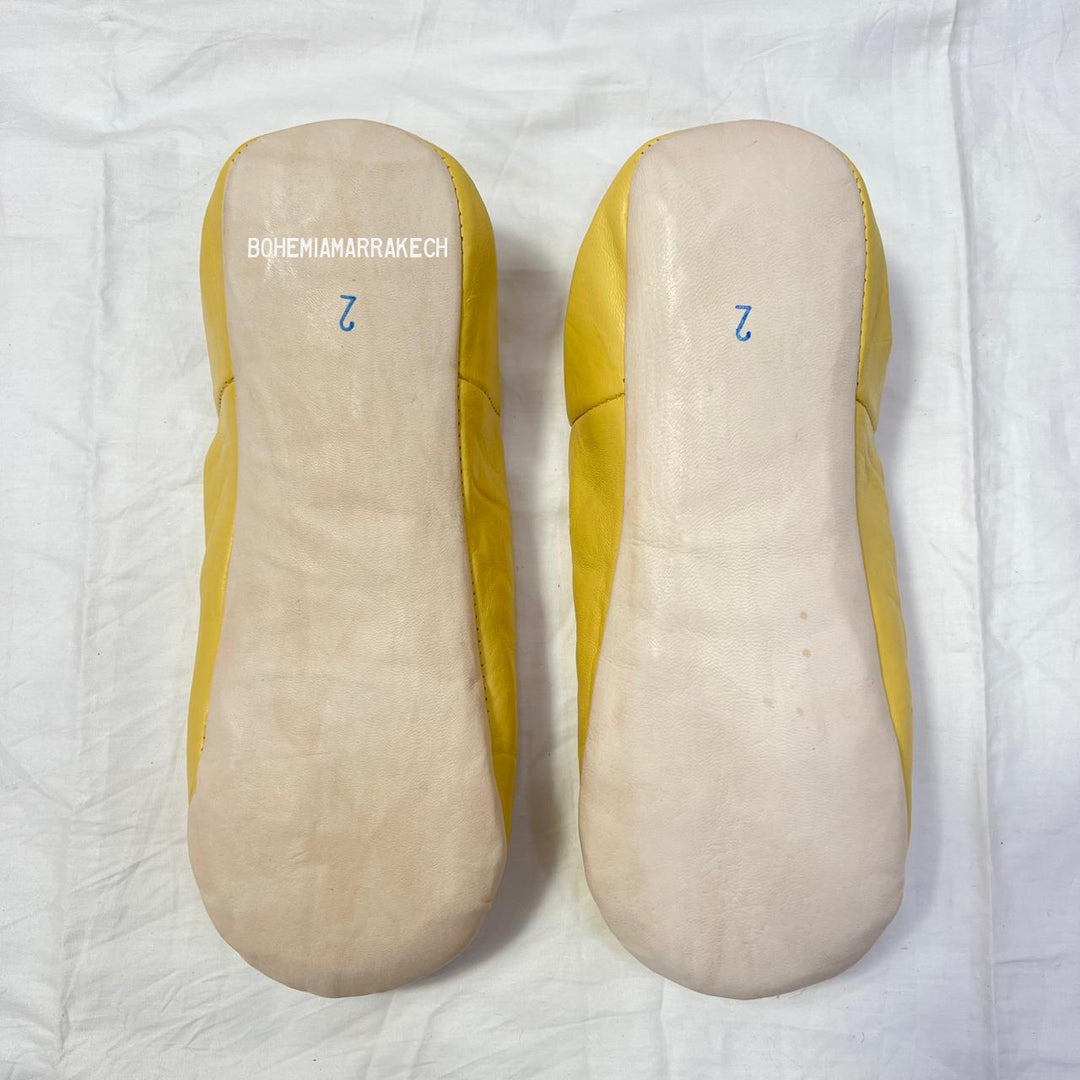 Artisan-made Moroccan babouche slippers for indoor wear.