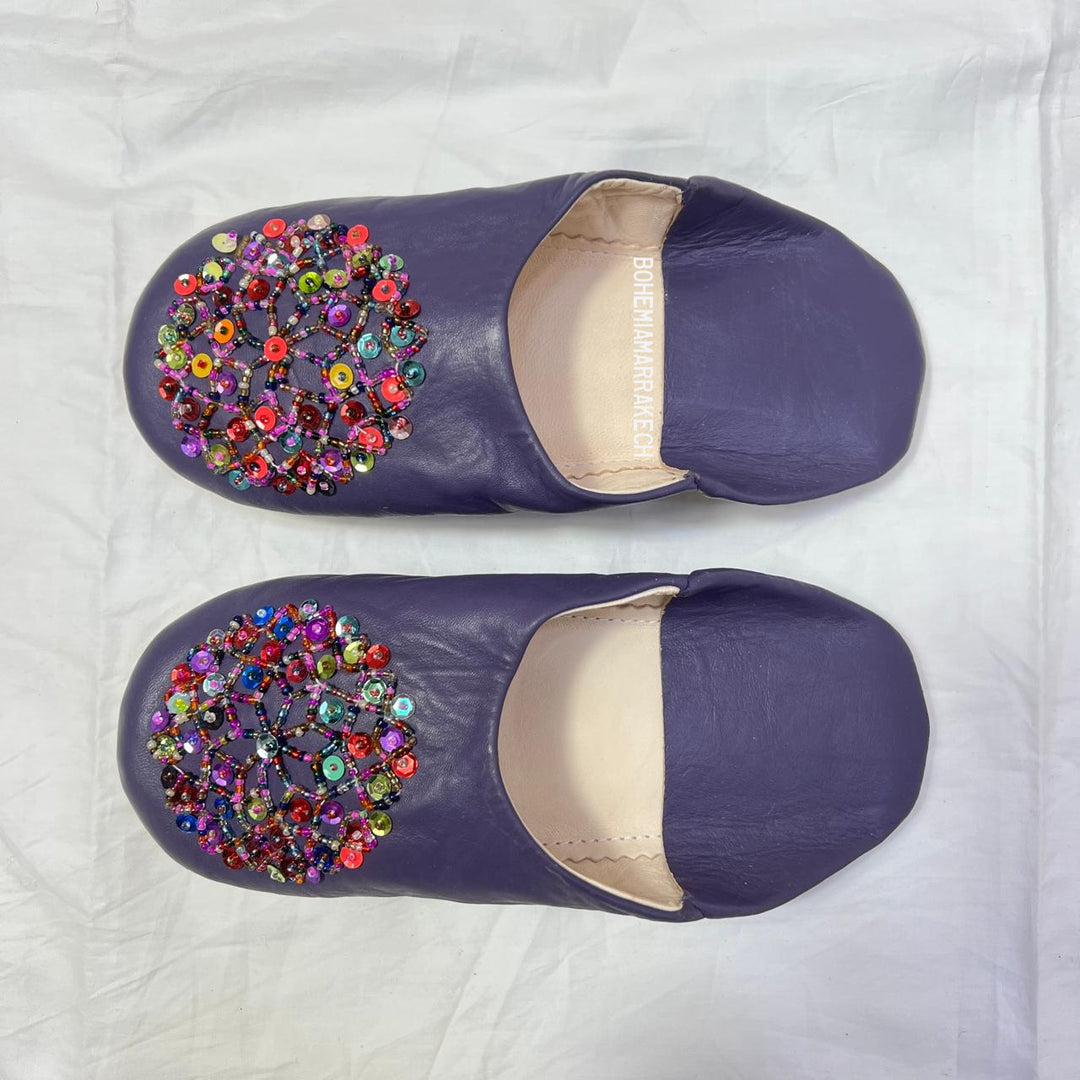 “Minimalist handmade Moroccan leather babouche slippers for indoor wear.”
