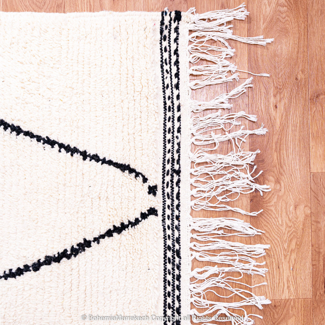 Black and white handmade Moroccan runner rug with diamond pattern in Beni Ourain wool style