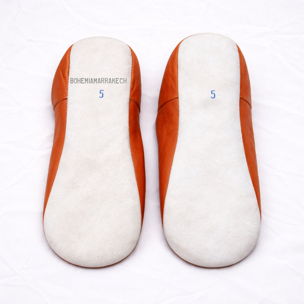 Handmade orange Moroccan babouche slippers in genuine leather with embroidered geometric design