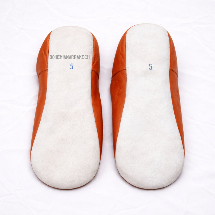 Handmade orange Moroccan babouche slippers in genuine leather with embroidered geometric design
