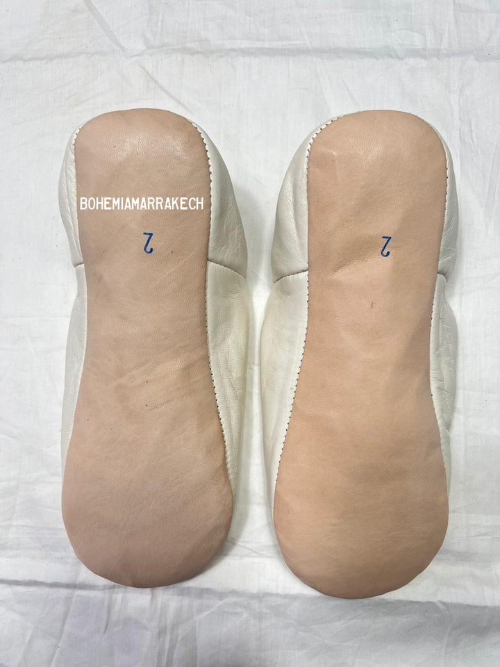 Hand-stitched ivory Moroccan leather babouche slippers with carved geometric design